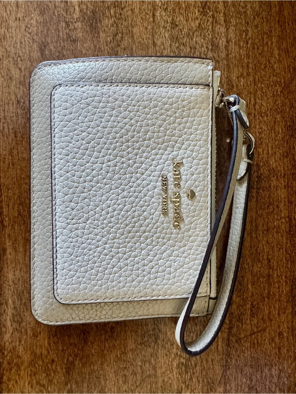 kate spade Light Gray Pebbled Leather Wristlet with Gold Logo